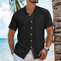 Man wearing a light blue loose fit cotton linen short sleeve cardigan shirt with a Henry collar.