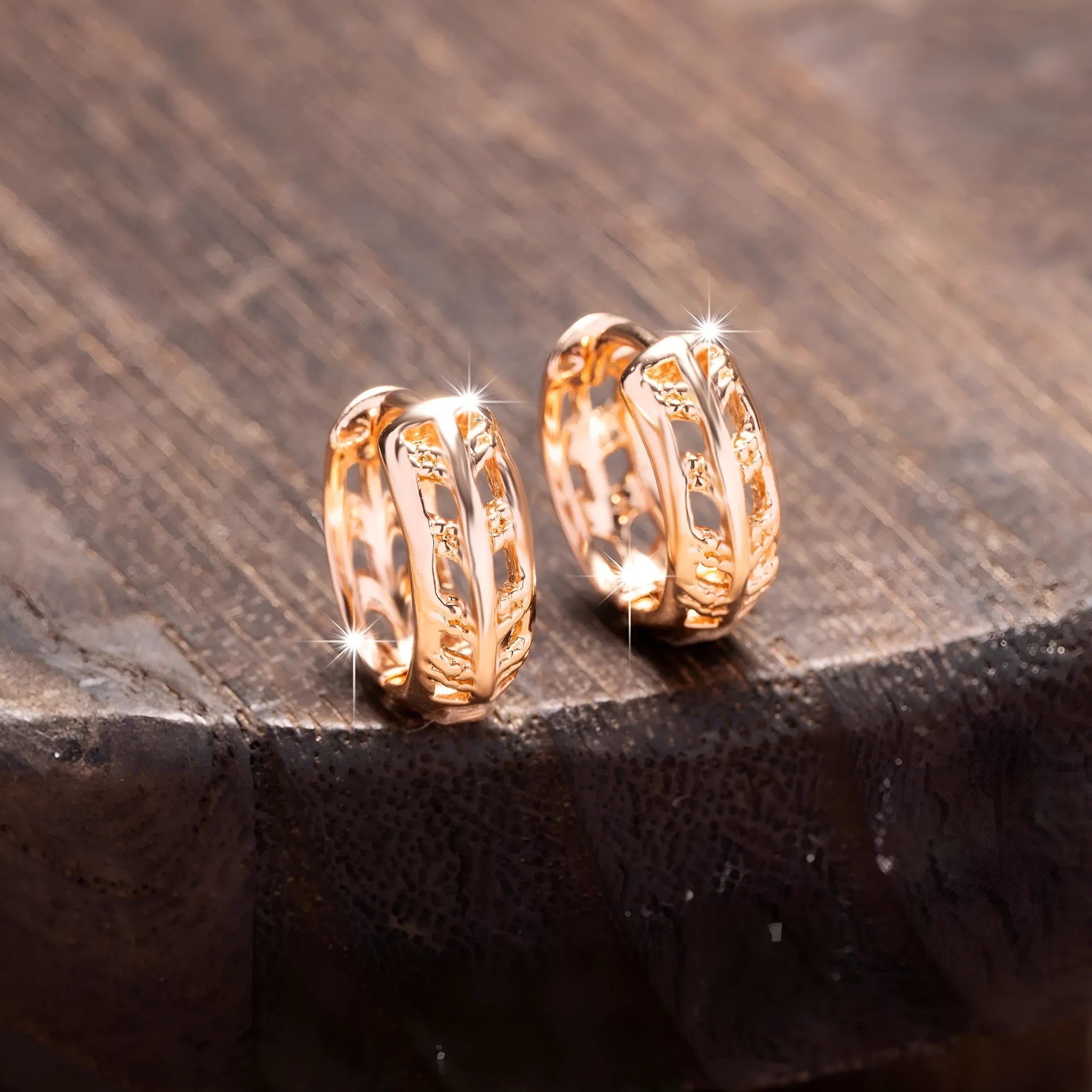 Rose gold plated copper stud earrings with hollowed leaf and heart design.