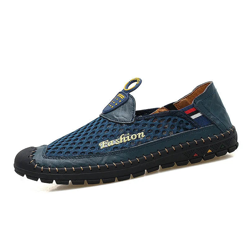 Men's brown casual shoes with mesh upper and rubber sole on a light background.