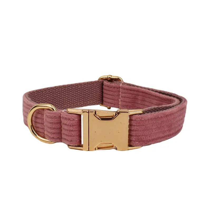 Red corduroy dog collar and matching traction rope set with vest, bow, and poop bag accessories