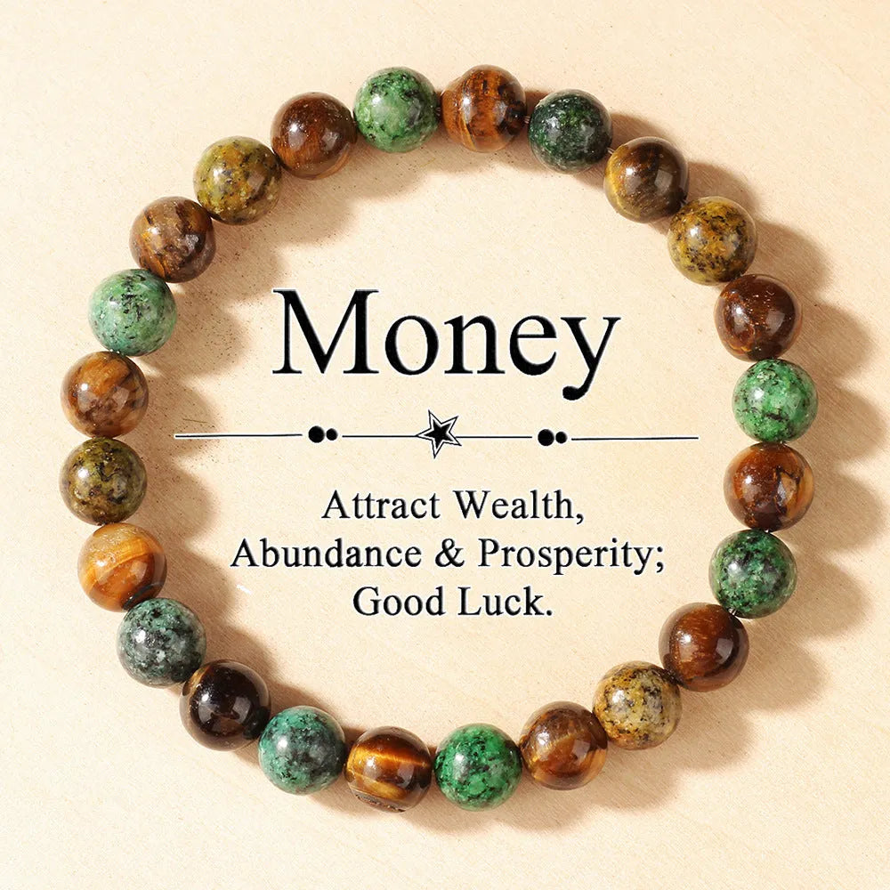 Handmade Tigereye stone bracelet with large flower-shaped bead and adjustable metal clasp on a cord.