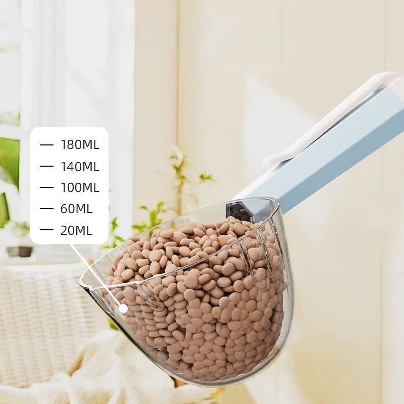 Blue pet food spoon with a clip attached to a dog food bag for hygienic feeding.