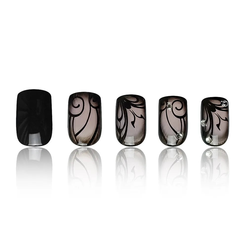 Dark Ins style black vine wearable nail tips set with jelly glue finish on a white background