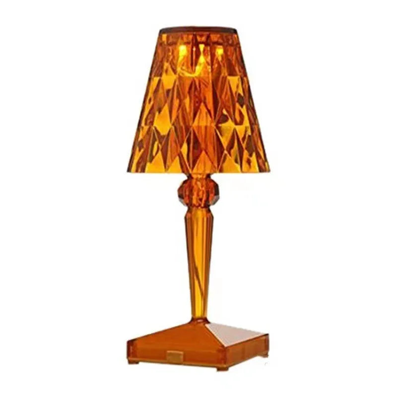 Rose gold portable touch night light on a surface, showing its acrylic construction and modern design.