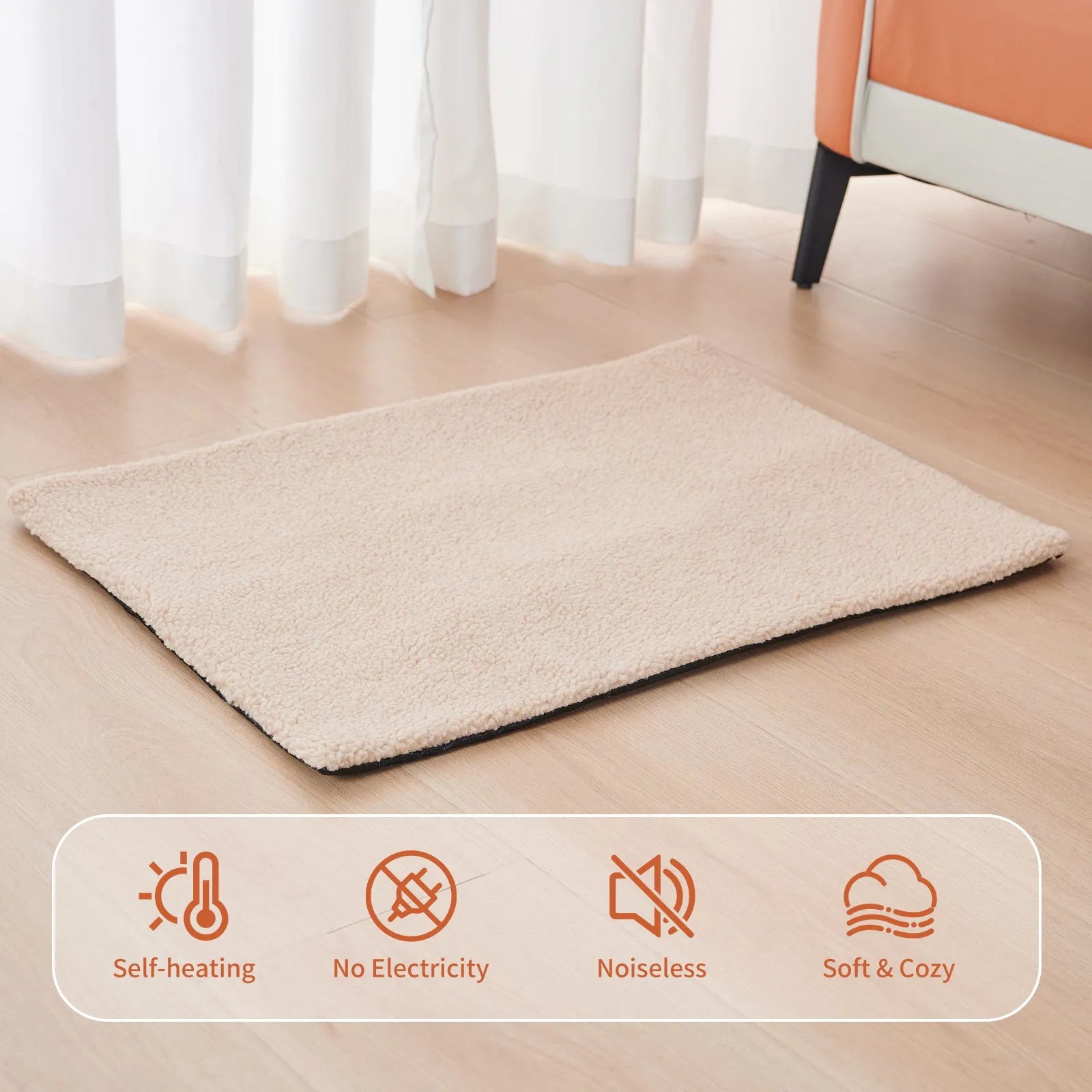Grey self-heating plush pet pad for cats and dogs on a wooden floor.