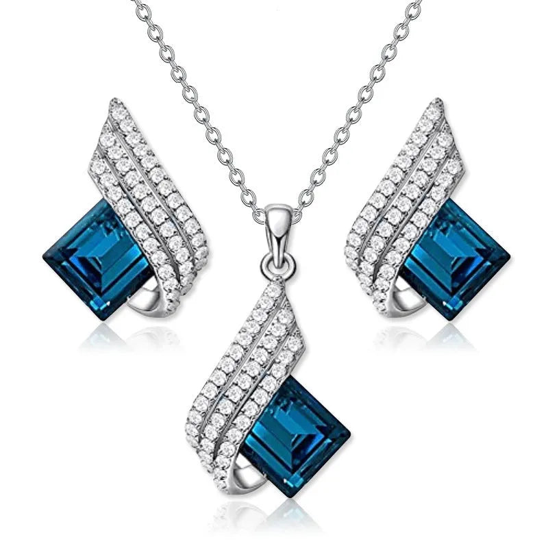 Women's electroplated necklace and earring set with alloy pendant and glass accents on cross chain
