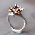 Silver two-tone floral geometric pattern alloy ring for women on a white background.