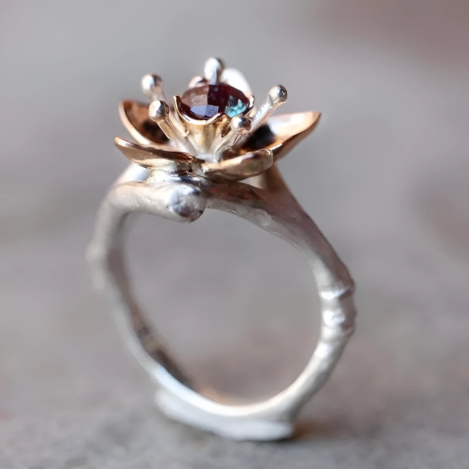 Silver two-tone floral geometric pattern alloy ring for women on a white background.