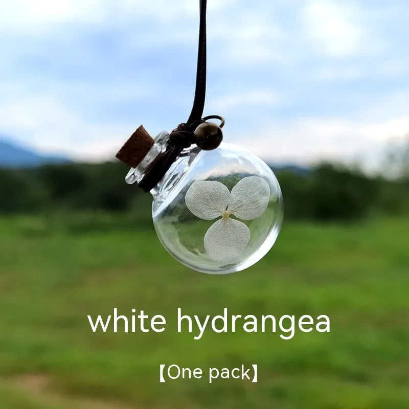 Glass car perfume pendant with preserved flowers in selected colour and diameter