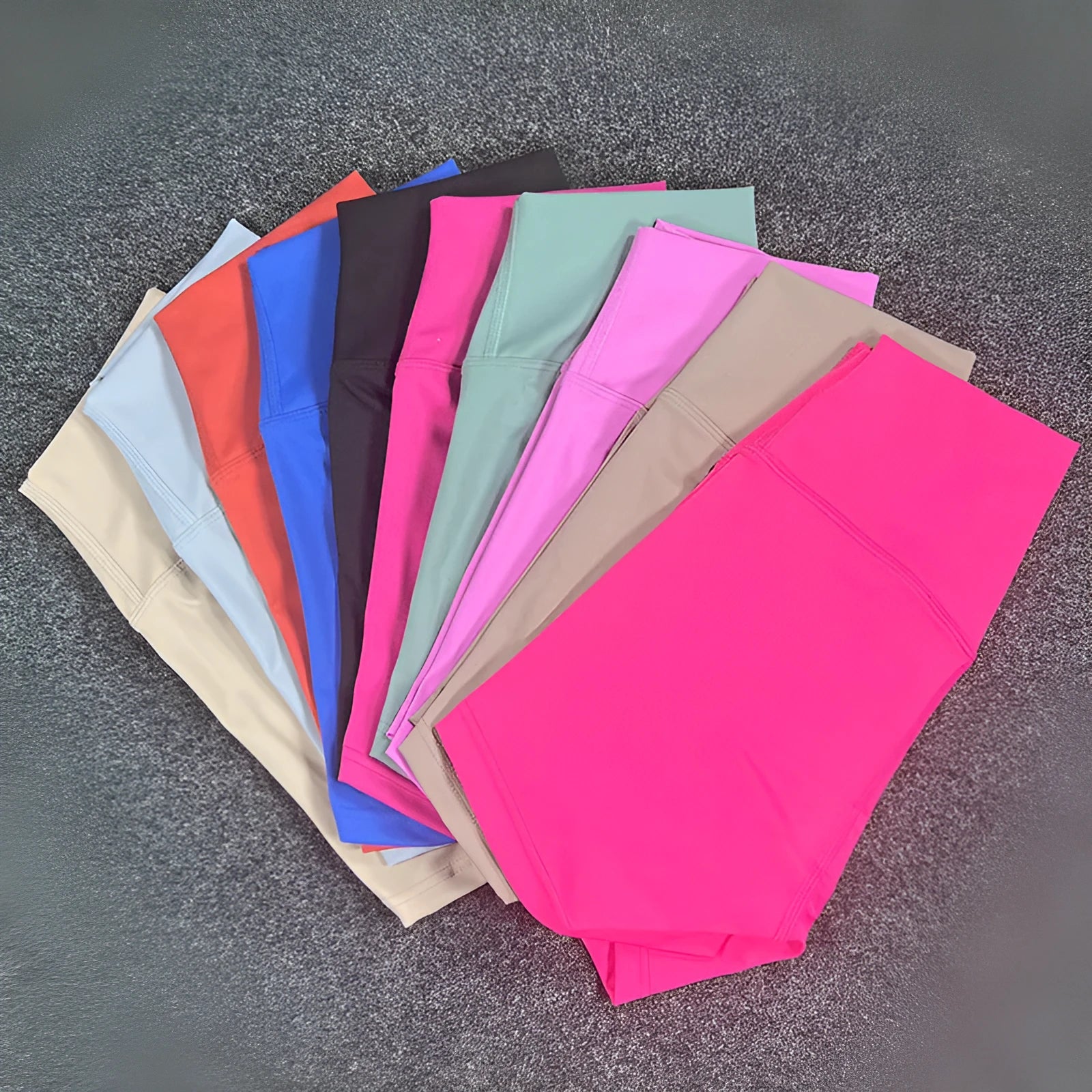 High-waisted yoga shorts for women in nylon fabric, shown in one of 15 available colours.