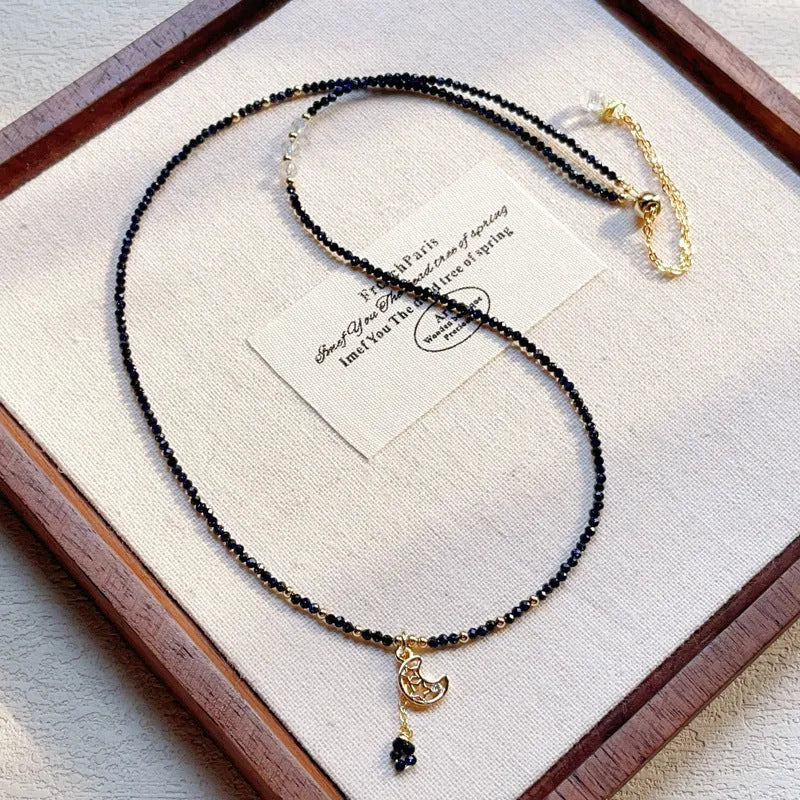 Women's multi-layer bracelet made of blue sand stone with three rings and gold-coloured accents.