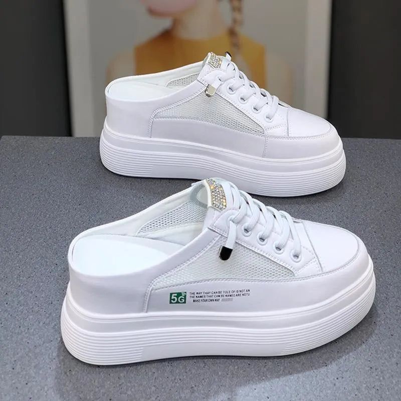 White women's casual platform shoes with mesh surface and heel-free design on a rubber sole.