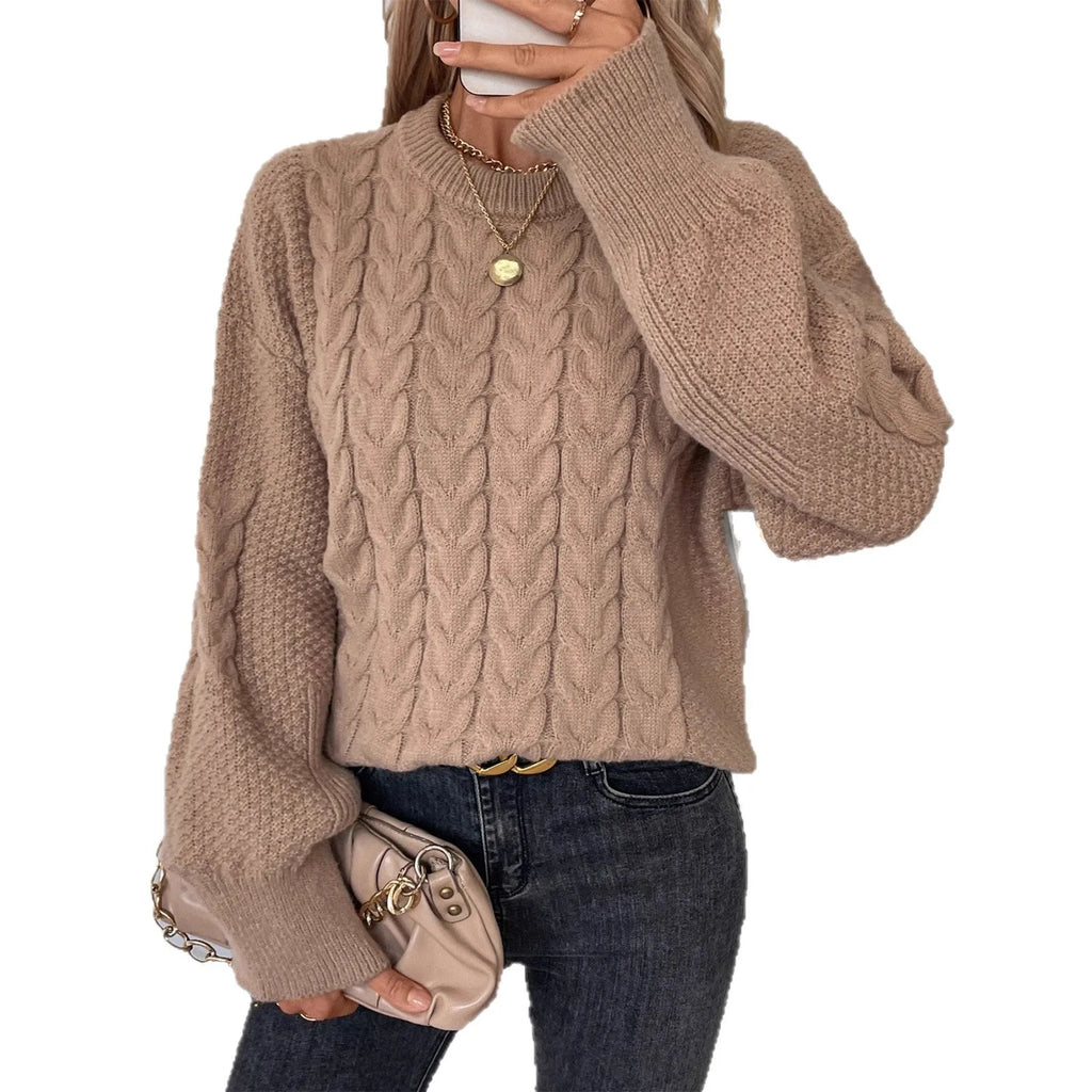 Women's beige casual sweater with a textured twist design and round neck.