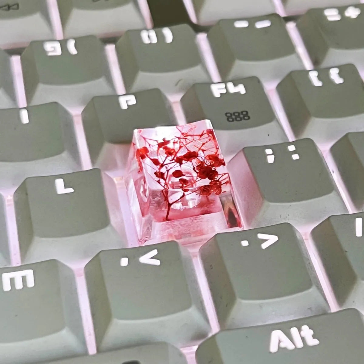 High-transparency starry sky design resin artisan keycap for mechanical keyboards, shown in green colour.