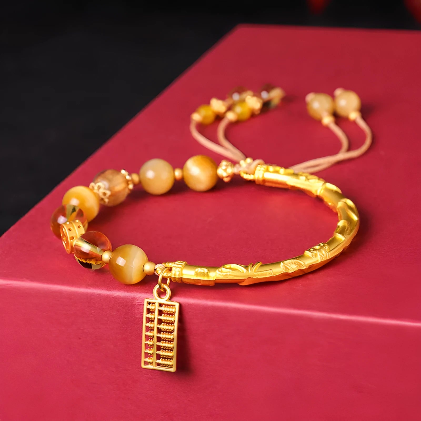 Women's tigereye and citrine abacus bracelet with diamond-shaped design and copper fastenings