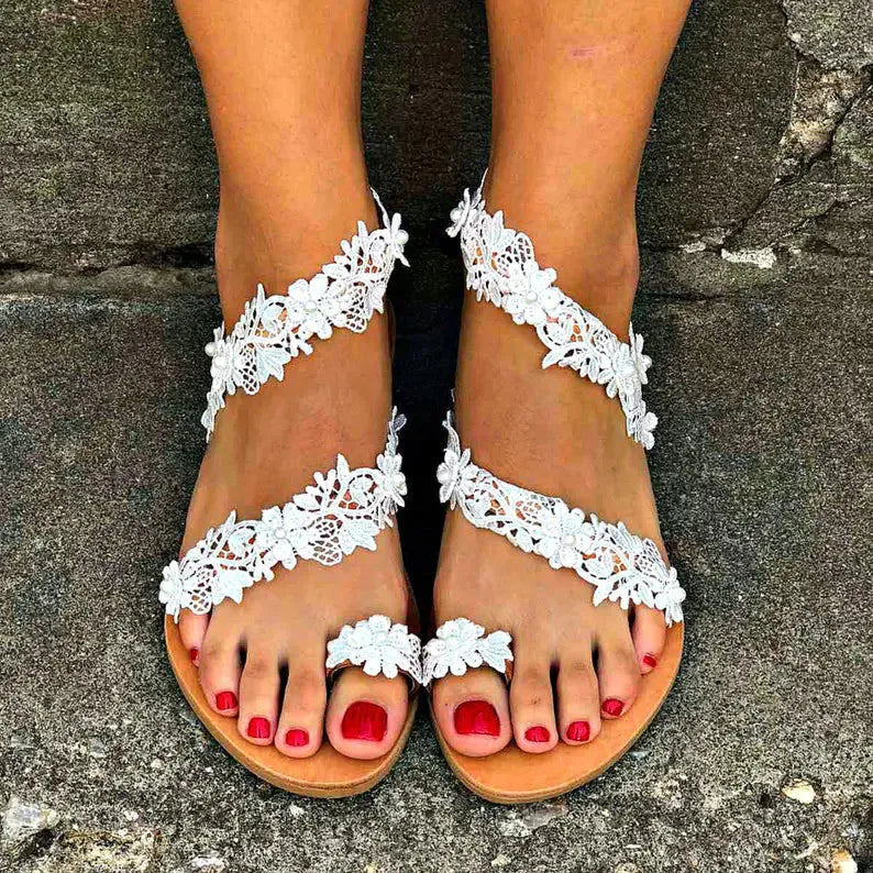White women's sandals with rhinestone floral decoration and patent leather upper in sizes 35-43