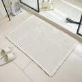 Absorbent non-slip bathroom carpet with checkered pattern in a neutral colour