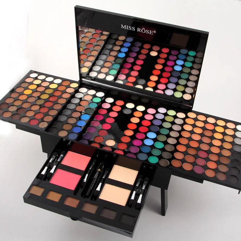 Piano-shaped makeup palette open to show 190 eyeshadow, blush, powder and contour pans