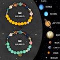 Pair of natural stone beaded bracelets with zodiac sign charms on an adjustable cord.