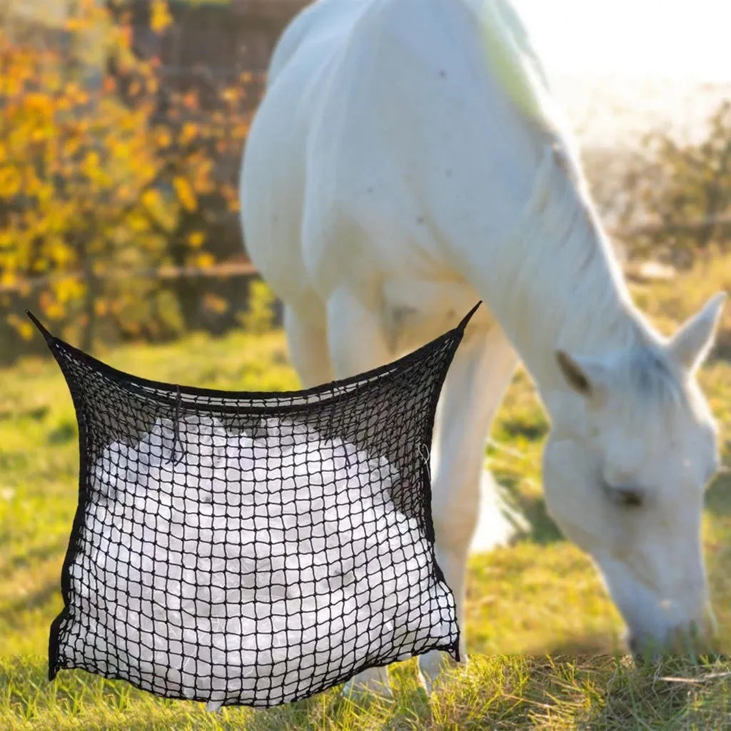 Woven grid horse feeding bag in black hanging, suitable for cattle and sheep.