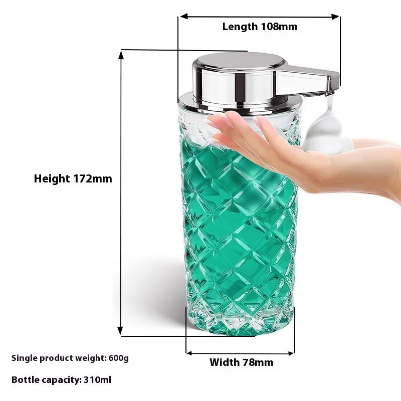Silver automatic soap dispenser with USB type-C charging port on a bathroom counter.