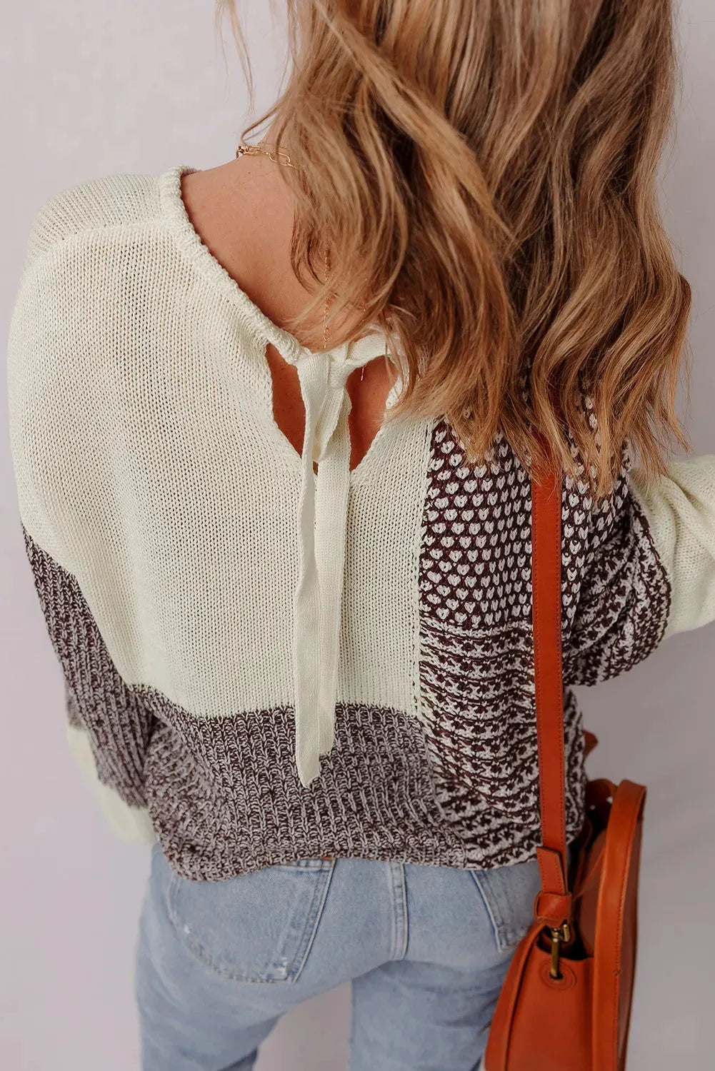 Dark khaki colour block loose sweater with a back tie and drop shoulder sleeves.