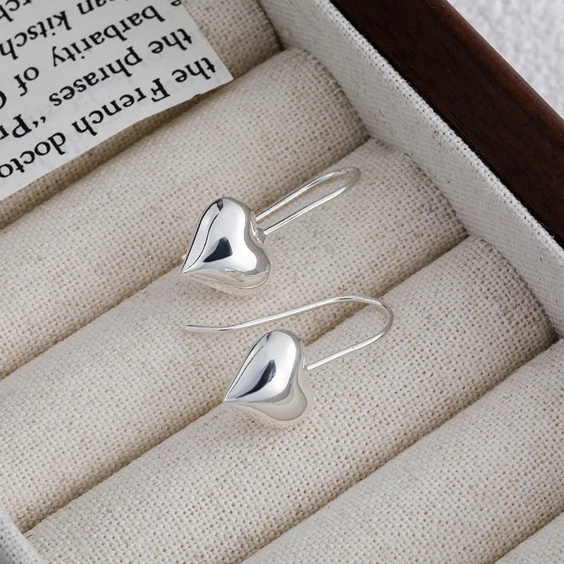 Silver heart-shaped earrings with Korean style design and glossy finish