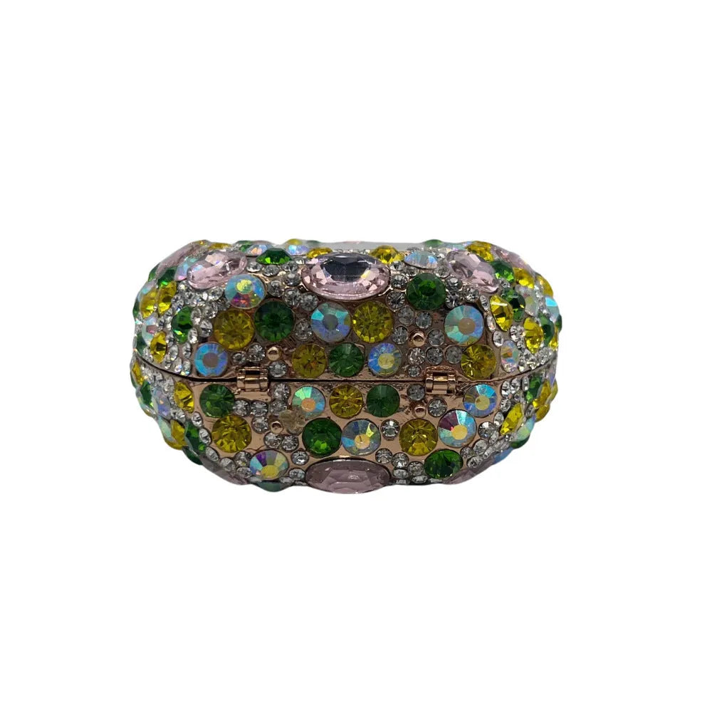 Hard-shell alloy women's clutch bag in a silver metallic finish, showing its three-dimensional pocket design.