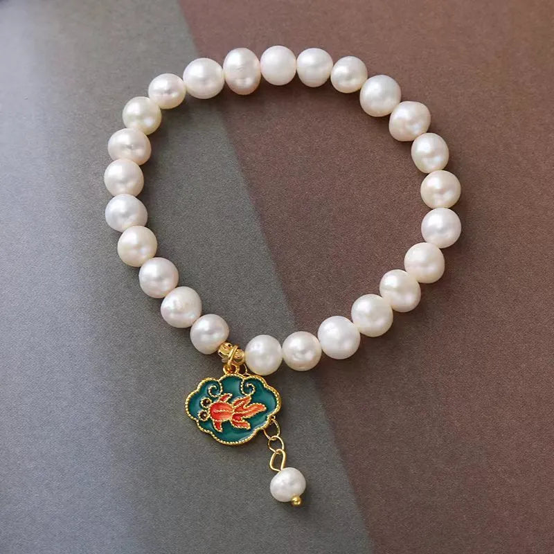 White freshwater pearl bracelet with lotus goldfish pendant in antique baroque style