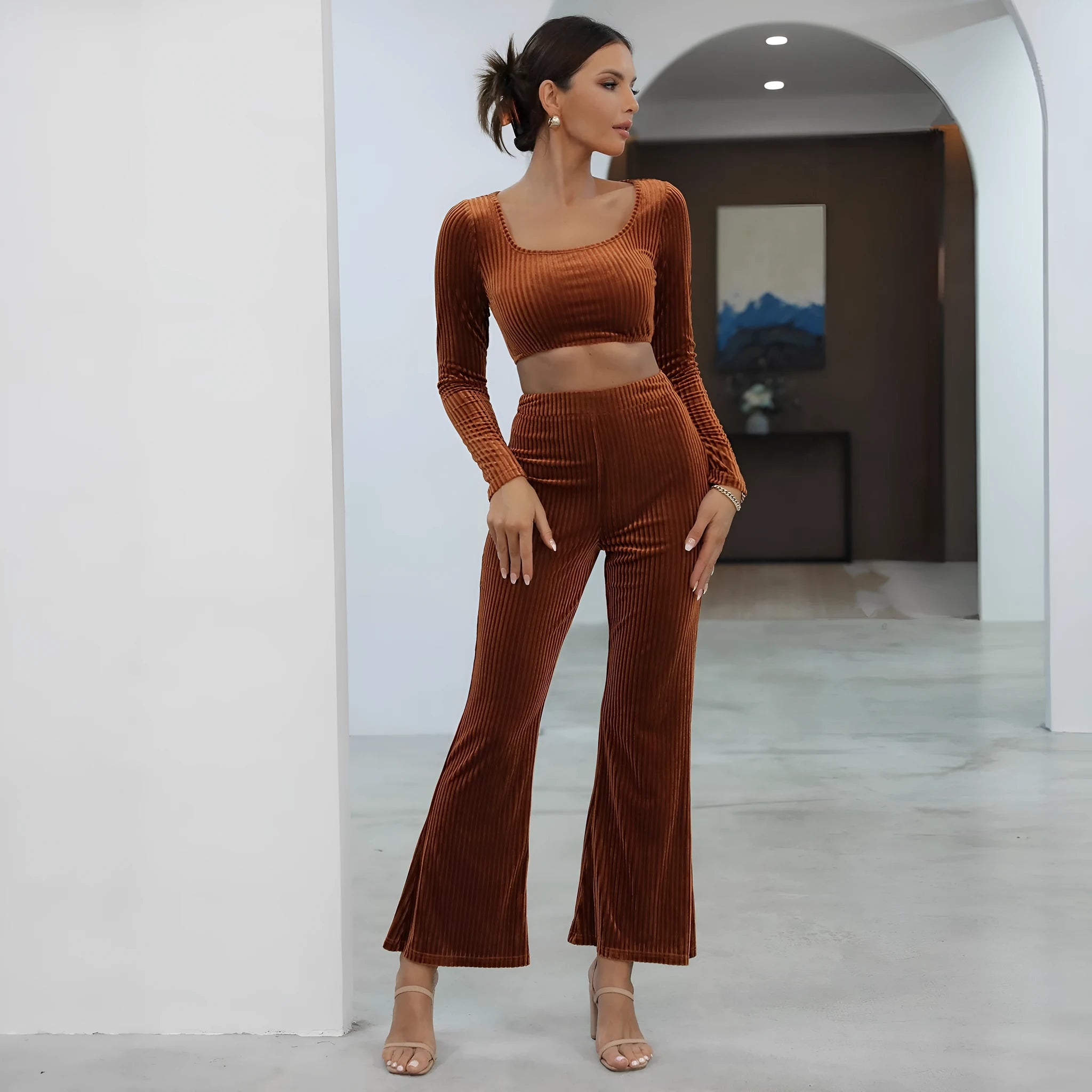 Caramel coloured long sleeve sweater and trouser casual set on a hanger.