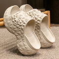 High heel Eva slippers with thick sole in khaki, black or white colours, showing flip-flop style design