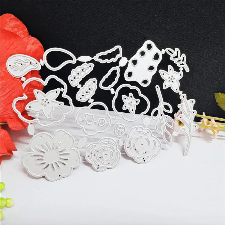 Silver carbon steel flower knife mould for paper cutting measuring 14.3cm by 9.9cm with etched botanical design