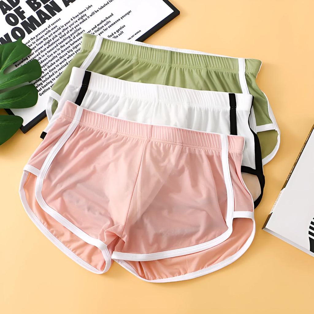 Men's ice silk boxer shorts in multiple colours showing low-waist mesh sports design.