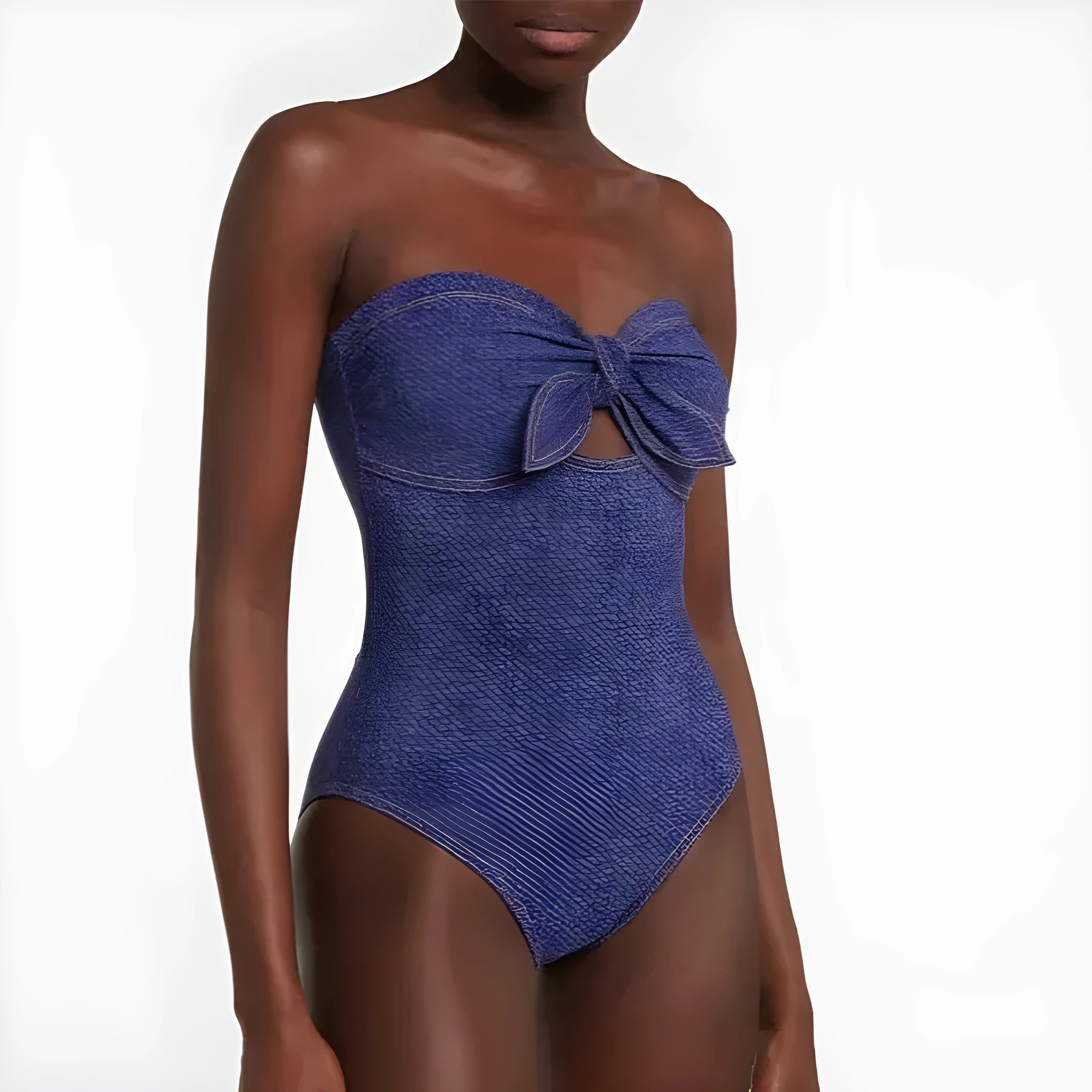 Women's vintage denim-colour one-piece swimsuit with a matching skirt laid flat.