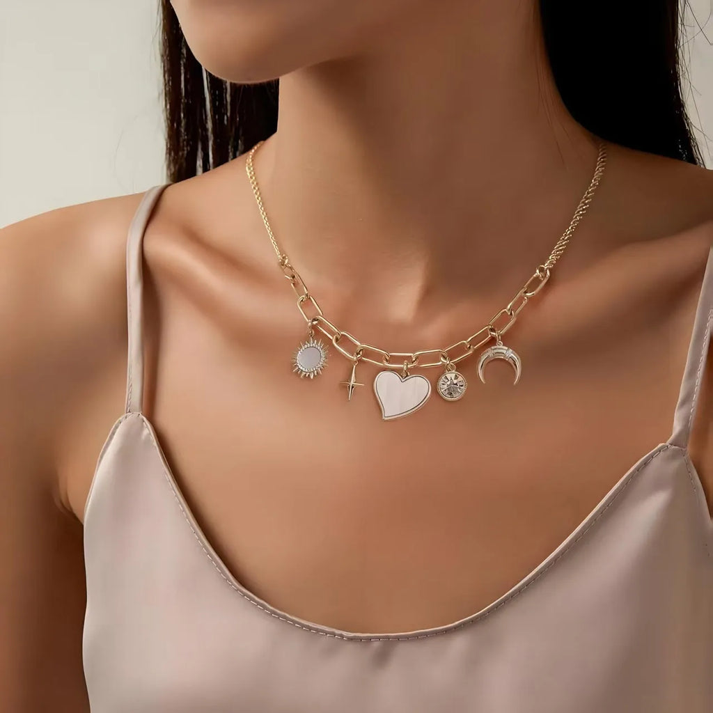Gold alloy pendant necklace with moon inlaid heart-shaped and star-shaped zircon on a bamboo chain