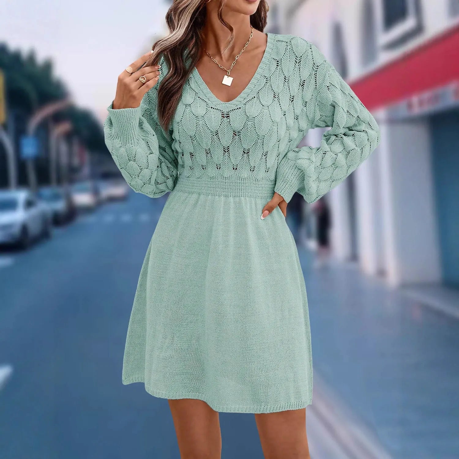 V-neck long sleeve acrylic beach dress with a high waist, shown in apricot colour.