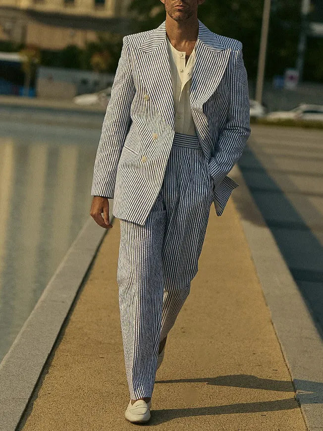 Blue and white striped polyester suit set with blazer and trousers on mannequin