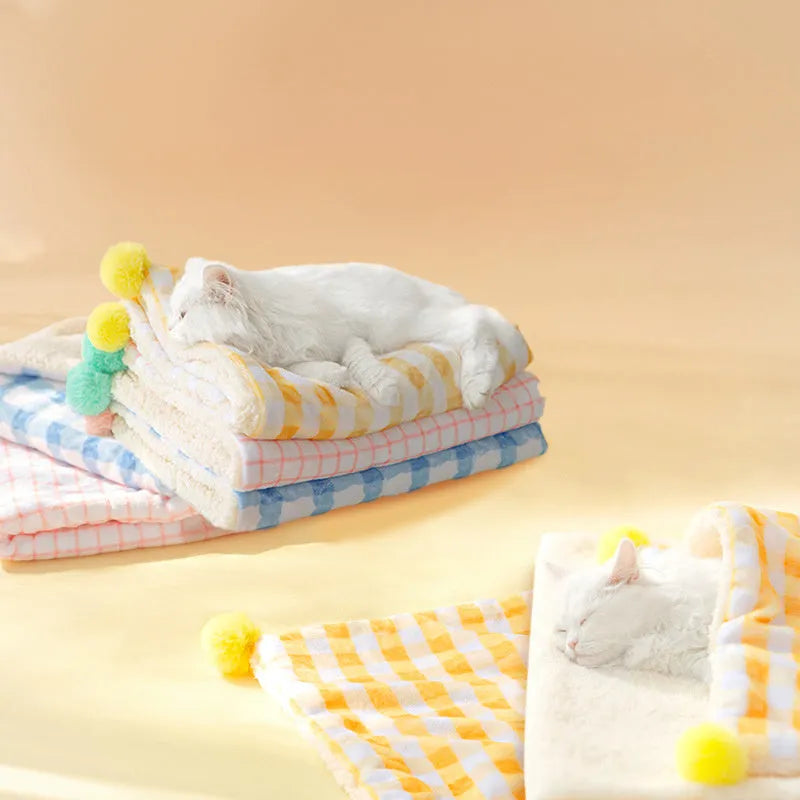 Blue coral fleece pet blanket shown in a large size next to a sleeping dog.