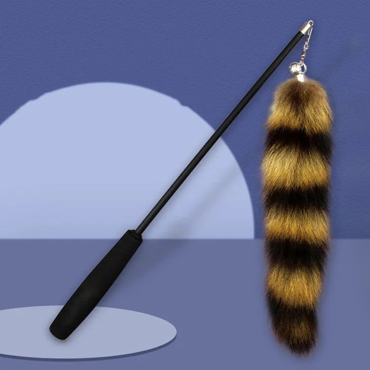 Black cat toy wand with a long elastic string and an attached teaser for interactive play.