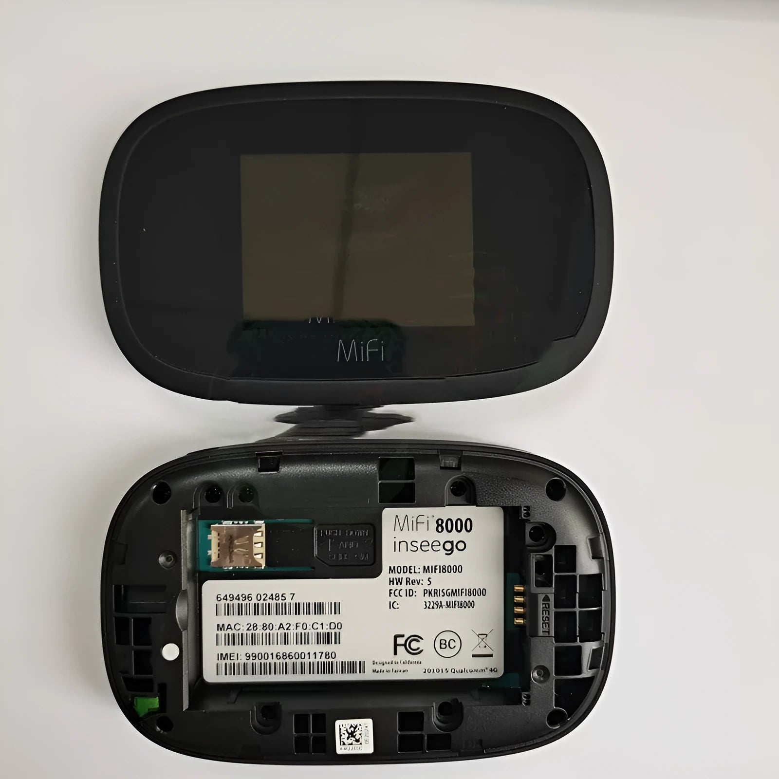 Black 4G portable wireless router with compact design for mobile internet access.