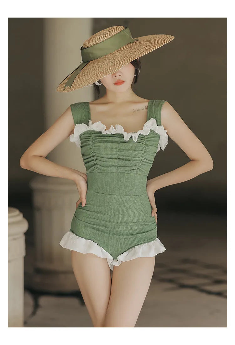 Women's high-waisted one-piece swimsuit in quick-dry polyester, shown in black, green, and pink.