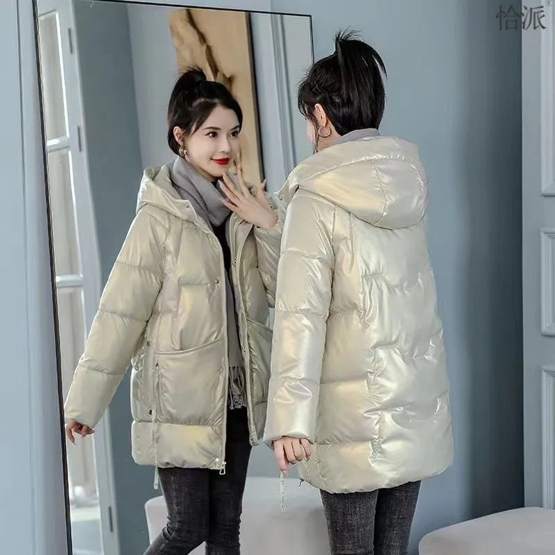 Women's loose thick hooded winter jacket in green, shown on a hanger.