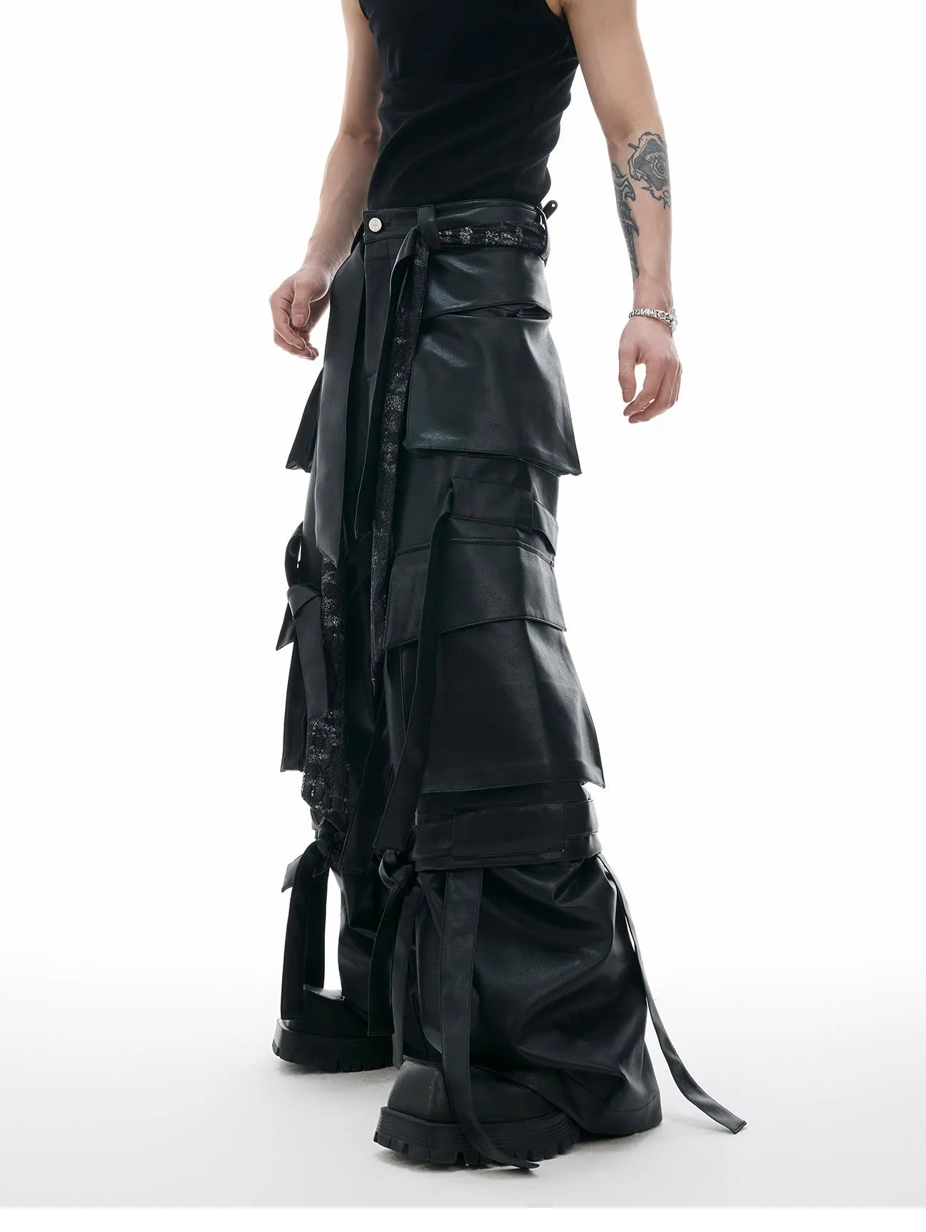 Black loose-fit quilted trousers with multiple pockets and PU leather composite fabric