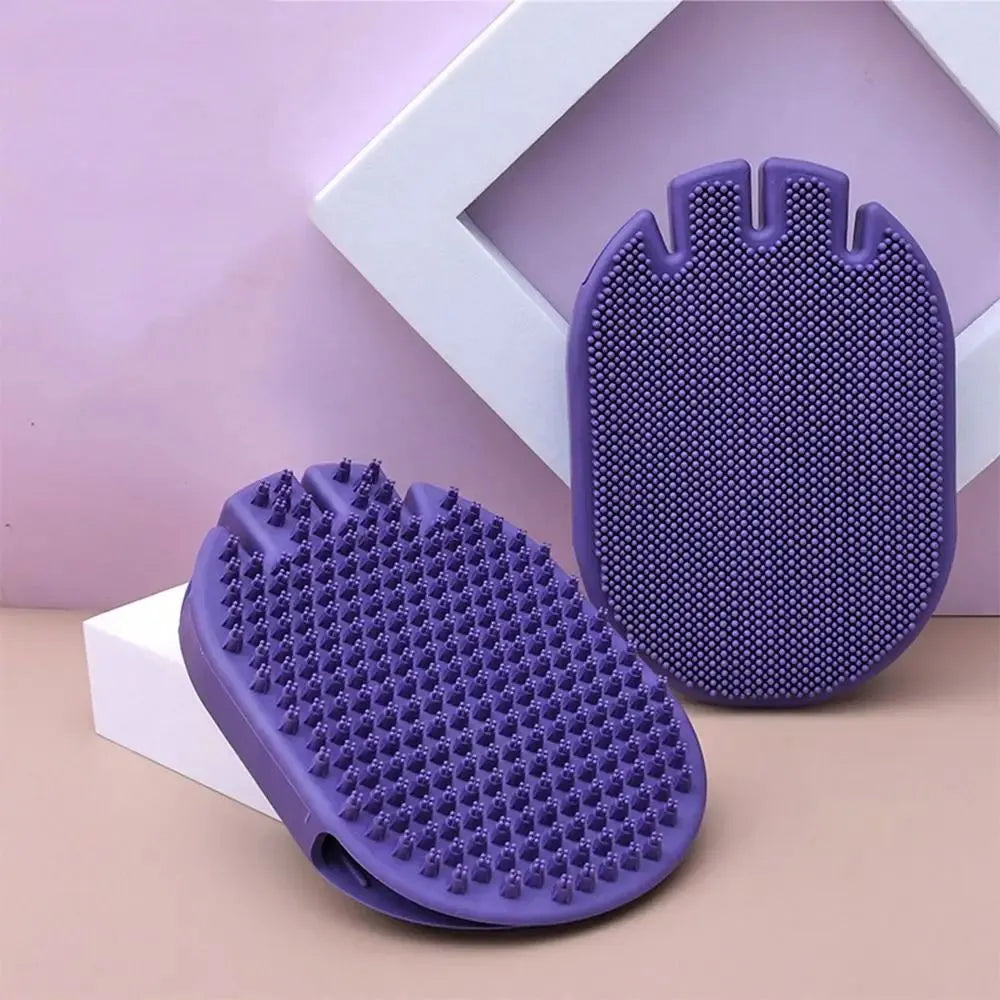 Purple dual-sided pet shampoo and massage brush with soft TPR bristles and ergonomic handle.
