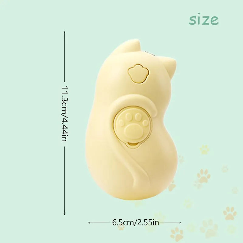 White 3-in-1 steam grooming brush for cats and dogs on a grey surface.