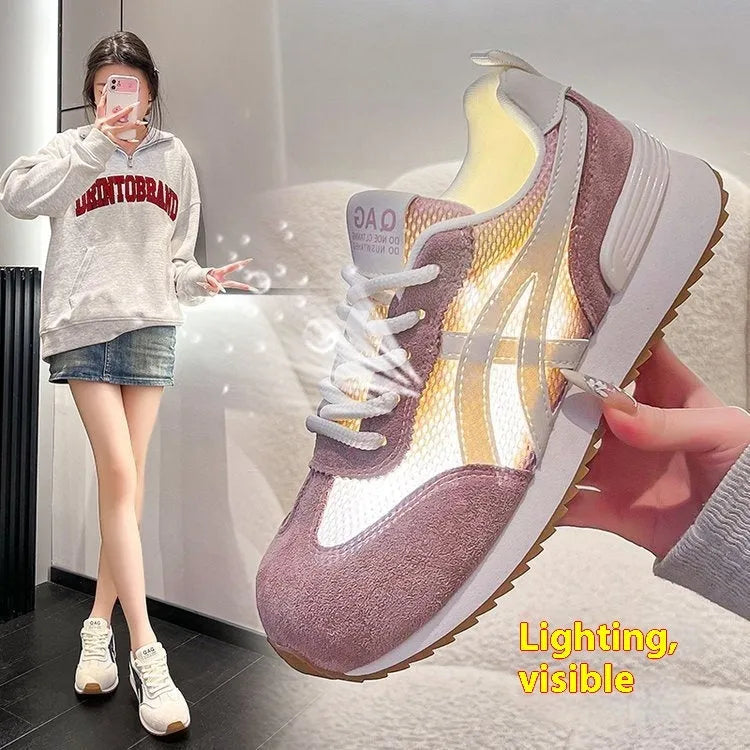 Women's white low-top lace-up sneakers with round toe on a flat plastic sole.