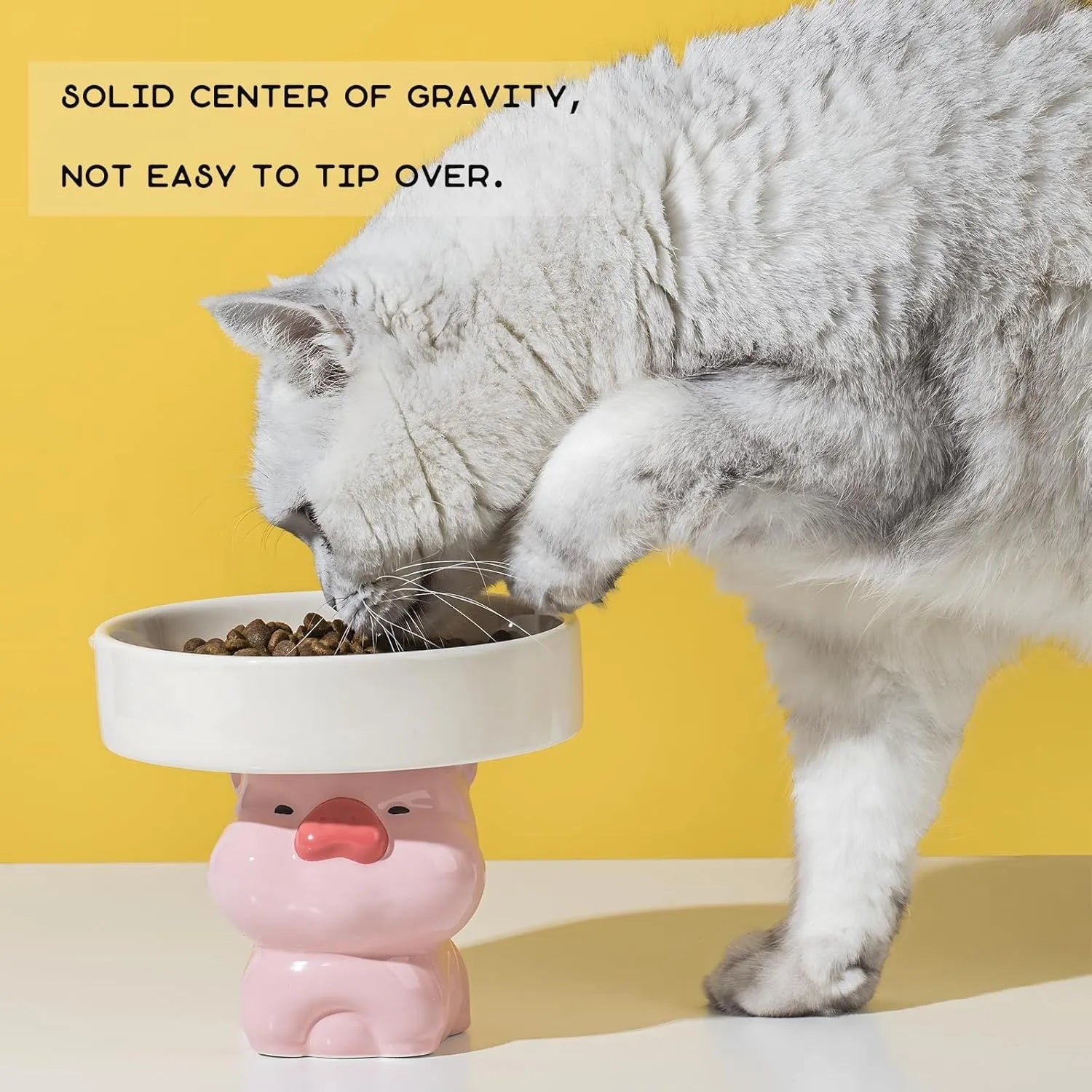 Raised ceramic pet bowl in animal design, showing wide opening for whisker comfort