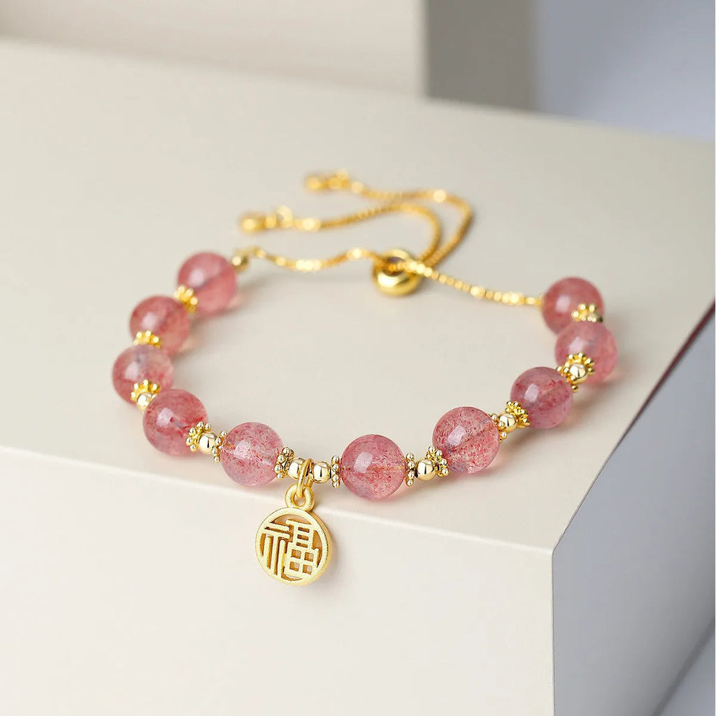 Strawberry quartz crystal bracelet with geometric shapes and fu charm for women