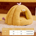 Green monster-shaped semi-enclosed cat kennel bed with ears and a removable cushion.