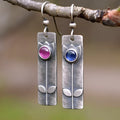 Antique finish red sapphire earrings with geometric shape and elliptic design elements